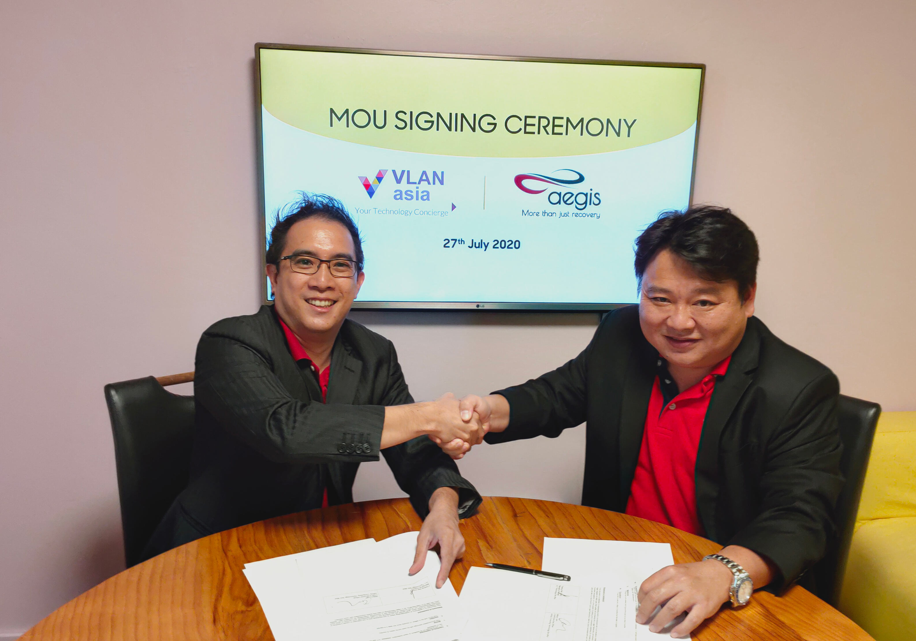 From left, Lance Cheang, Managing Director of VLAN technology Sdn Bhd and Wilson Lam, Chief Executive Officer of Aegis